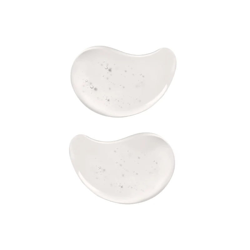 Patch occhi in idrogel trasparenti fotografate su sfondo chiaro, con texture gelatinosa e forma anatomica visibile
